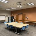 Tables and chairs set up in the Trillium Meeting Room