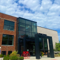 McConnell Arts Center brick and glass building against a blue sky