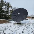 Smartflower solar panels in front of Northwest Library with snow on the ground