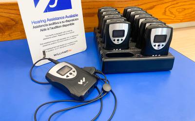 FM system receivers sitting on a blue table