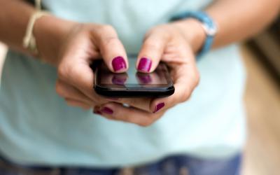 Close-up of a woman texting on her cellphone