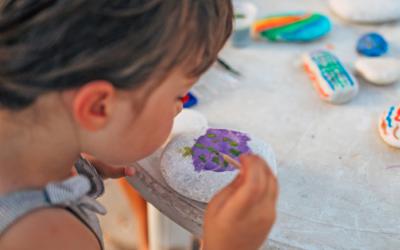 Child painting a rock