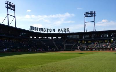 Green grass of Huntington Park baseball field with stands