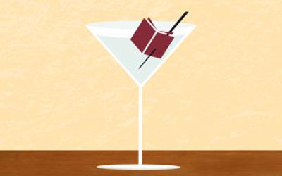 Martini glass with open book as garnish