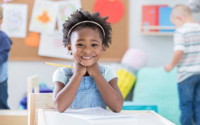 Child sitting at a classroom desk